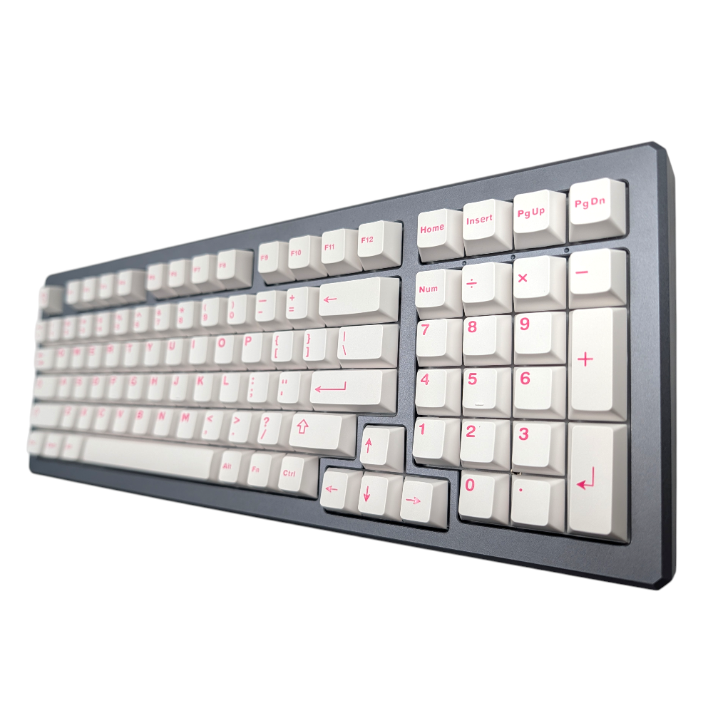 Detail of pink alpha legends contrasting with white keycaps for a modern look.