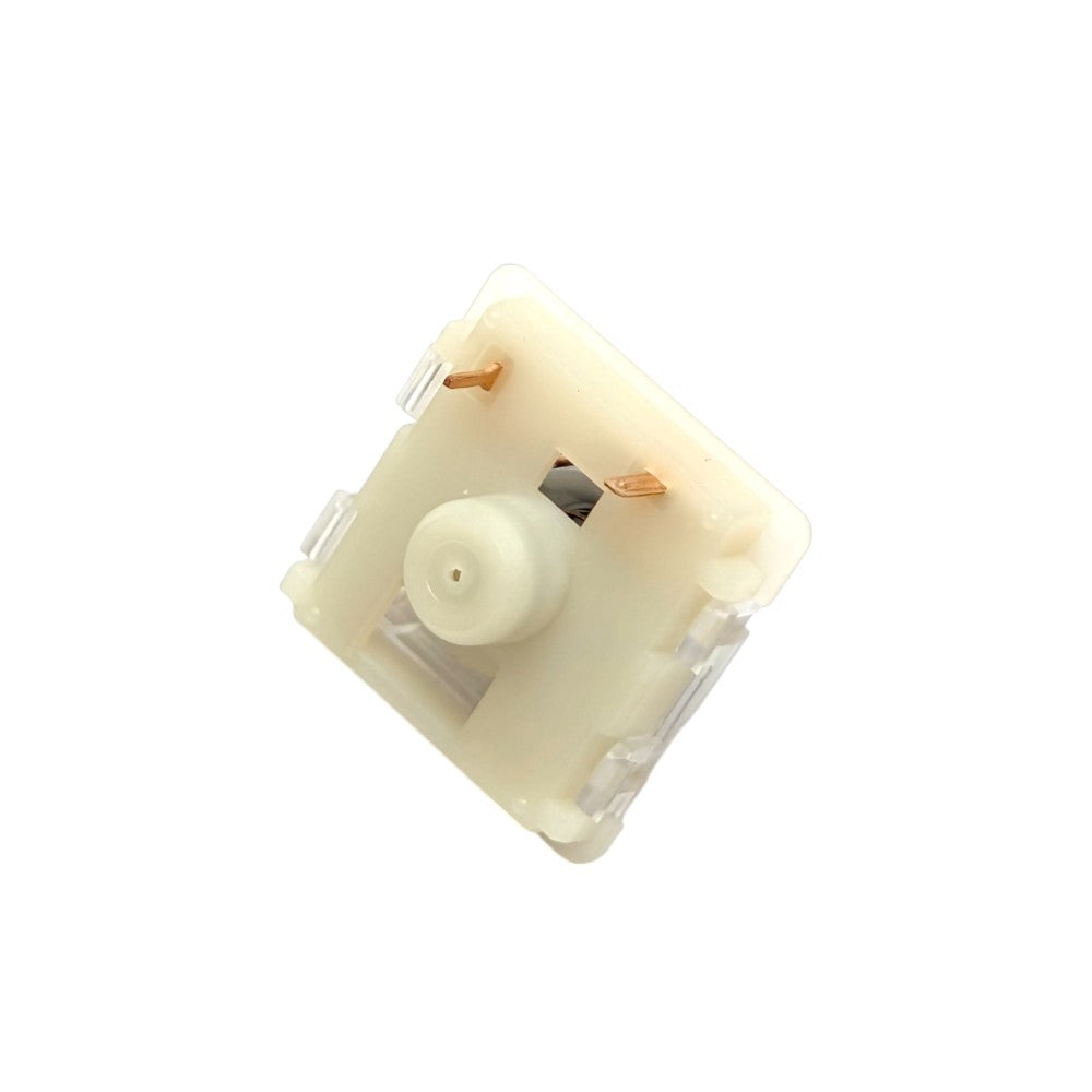 A single mechanical keyboard switch in a warm cream or off-white plastic housing, shown from an angled top-down view on a solid white background.
