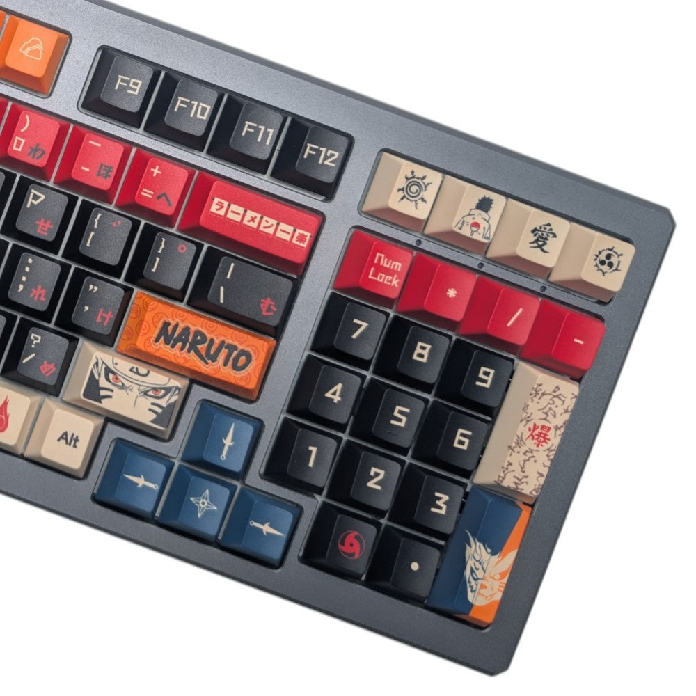 A close-up of a custom mechanical keyboard featuring anime-inspired keycap designs, including a prominent orange 'NARUTO' keycap and character illustrations.