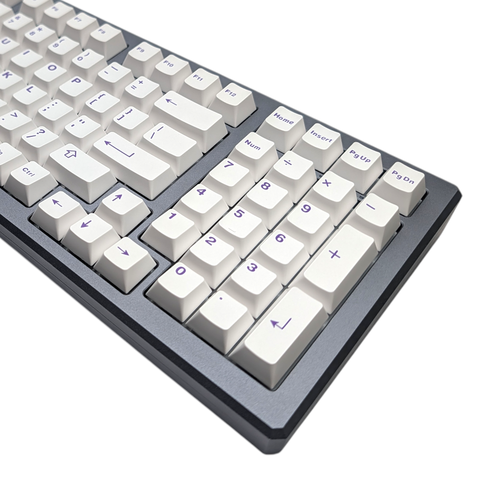 Close-up of crisp white alpha keycaps with purple legends, showcasing ABS double-shot quality.