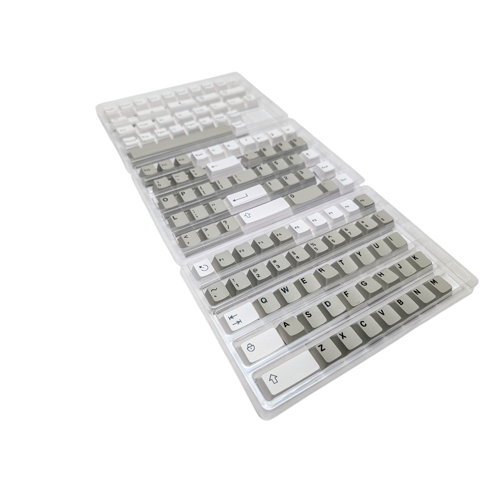 Close-up of space gray and pure white ABS double-shot keycaps.