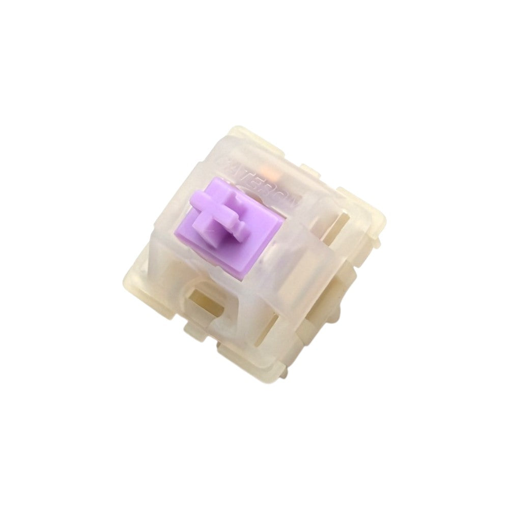 Angled front view of Gateron Milky Purple Pro mechanical switch showcasing molded Gateron logo and LED cutout slot.