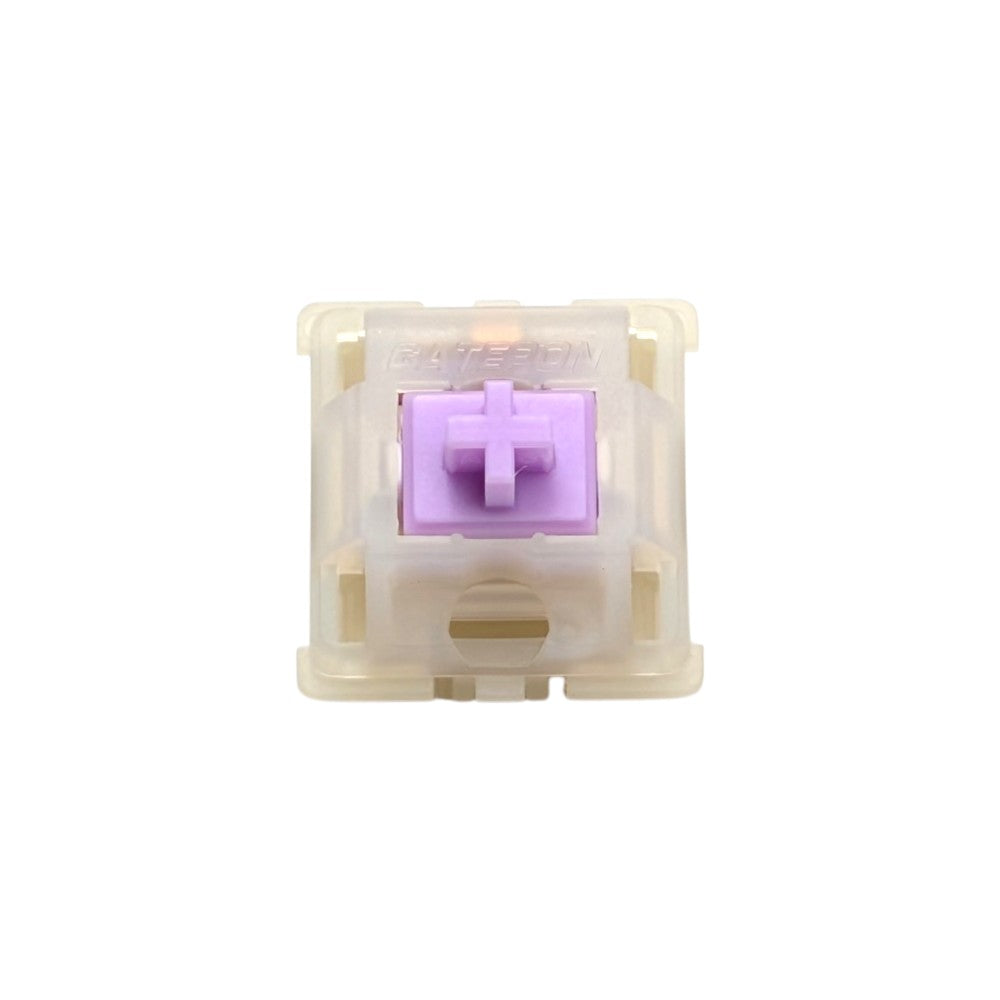 Top-down macro view of Gateron Milky Purple Pro silent tactile switch showing lavender POM stem and milky translucent housing.
