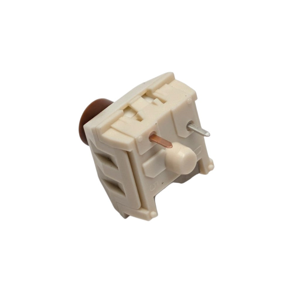 Bottom angled perspective shot of Kailh Box Cream Pro switch showing PCB mounting legs and central stem hole.