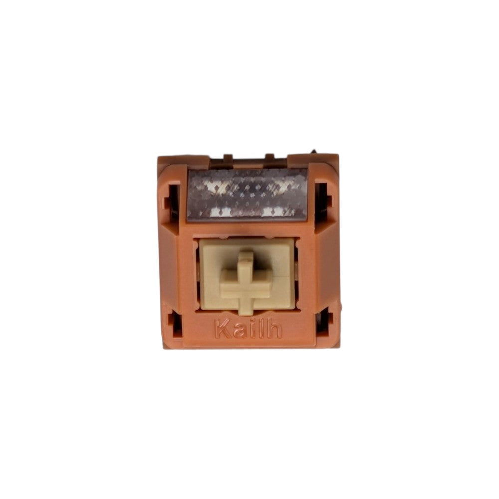 Top view of the Thock King Kailh Folklore Wow linear switch, terracotta housing and beige stem.