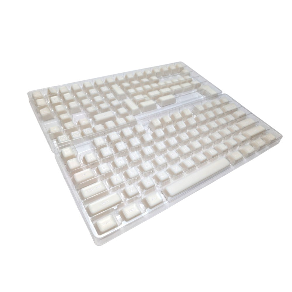 Angled view of Thock King Milky Marshmallow SA keycaps on a dark keyboard.