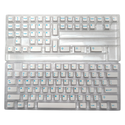 Styled shot of Aqua Clarity white and turquoise/teal keycaps, perfect for a custom setup.
