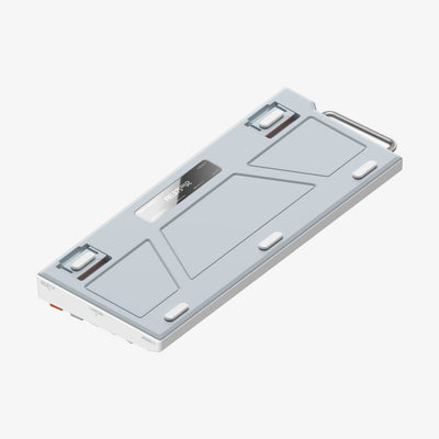 A slim rectangular electronic device with a light gray top cover, metallic silver edges, and a small display window, shown at an angle on a plain light gray background.