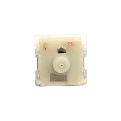 A single mechanical keyboard switch module shown from the back, featuring a translucent off-white plastic case, a central white pivot wheel, and copper-colored contacts, isolated on a white background.
