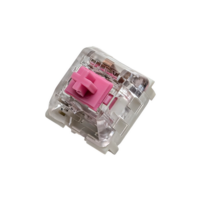 Macro shot of a Kailh Speed Pink clicky switch for custom mechanical keyboards, featuring the signature pink POM stem and clear housing for RGB lighting