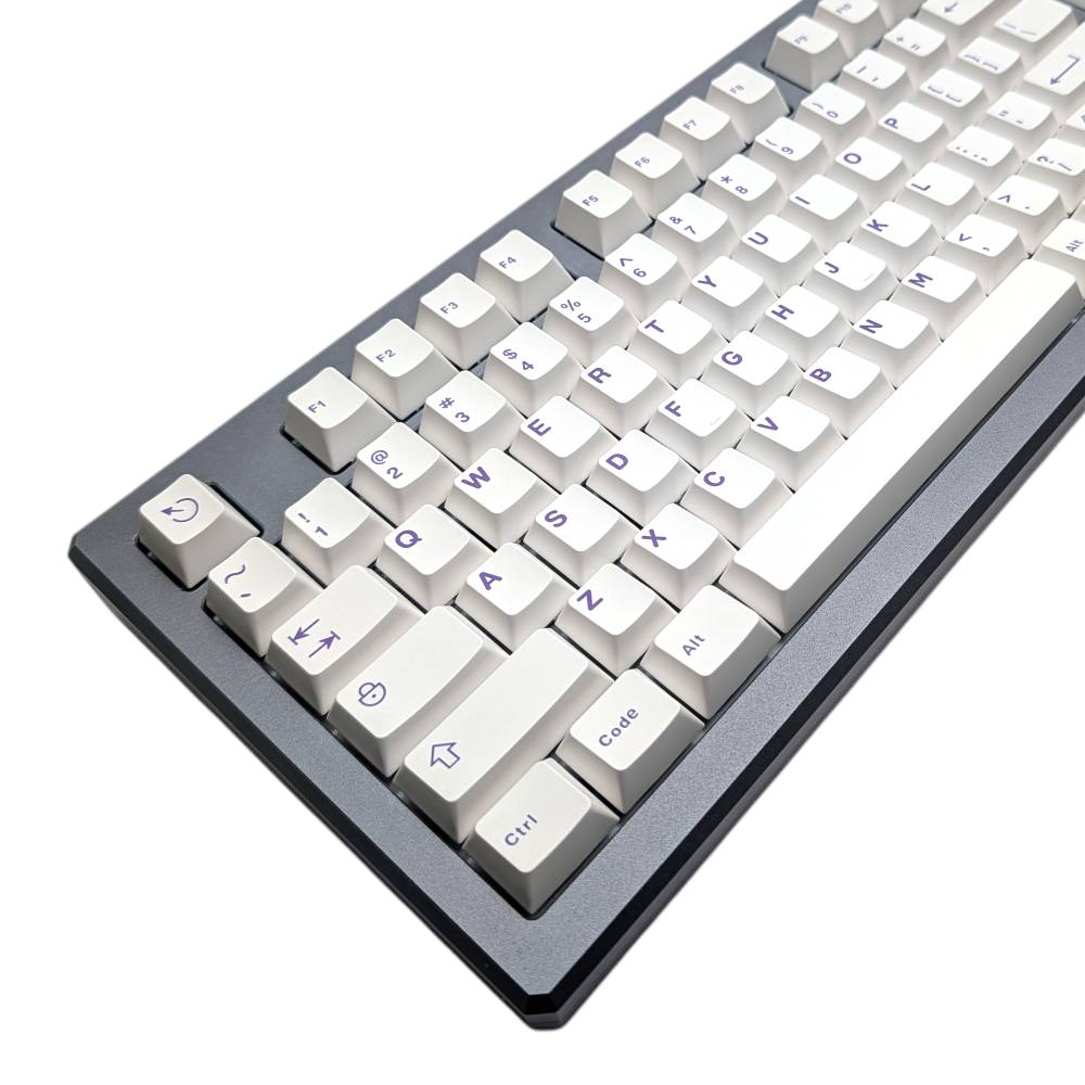 Overhead shot of durable ABS double-shot keycaps in Polar Purple colorway.