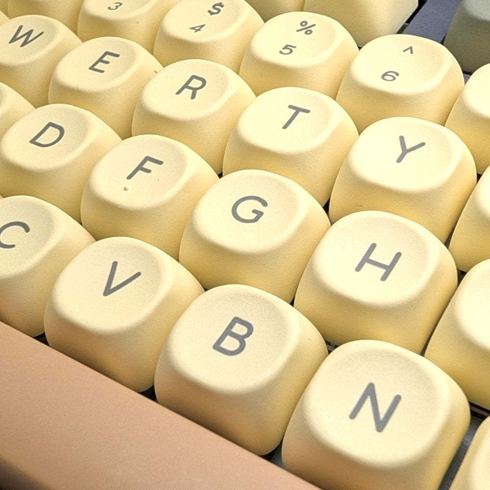 Macro close-up shot showing the smooth matte texture and dye-sublimated legends of 1.7mm thick PBT MOA keycaps.