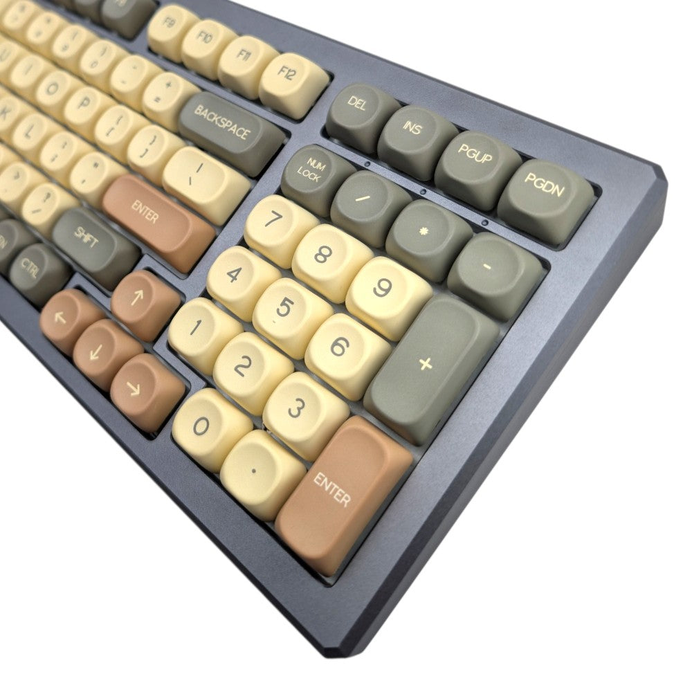 Detailed view of the numpad section and arrow keys with brown and cream MOA profile PBT keycaps