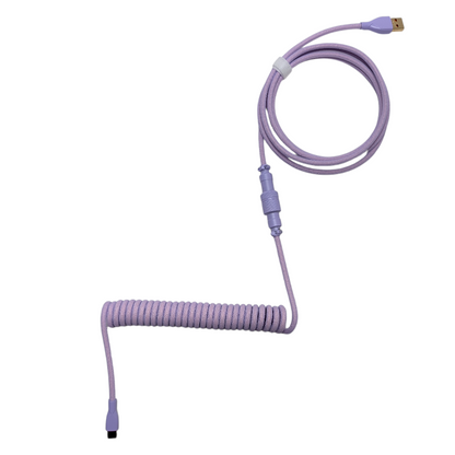 Lavender Dream custom coiled keyboard cable in lilac purple with a tight, springy coil and USB-C connection for gaming setups.
