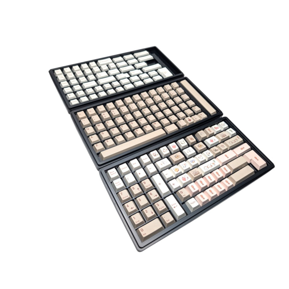 Complete 189-piece Cozy Critters PBT MOA keycap set in storage packaging trays by Thock King.