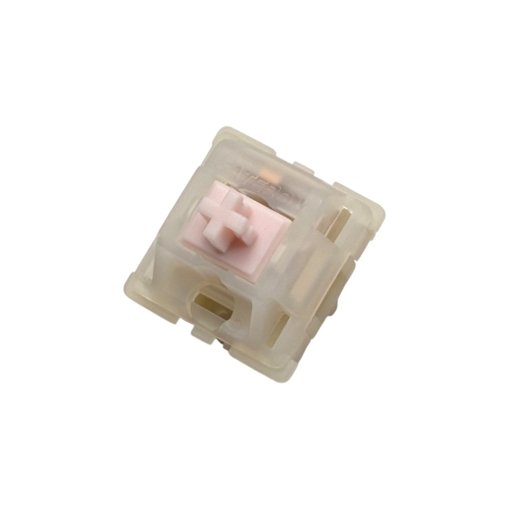 Angled front perspective view of Gateron Milky Pink Pro mechanical switch displaying molded Gateron logo and LED slot.
