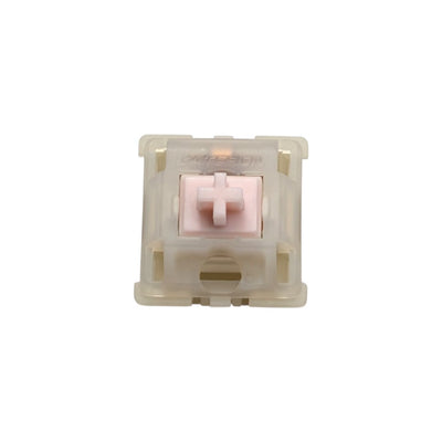 Top-down macro view of Gateron Milky Pink Pro linear switch showing pastel pink POM stem and milky translucent top housing.