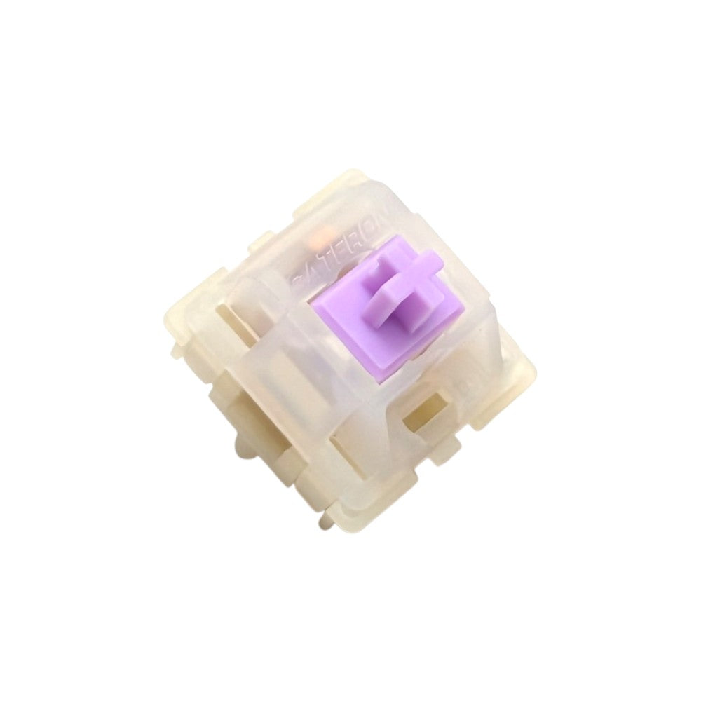 Angled front view of Gateron Milky Purple Pro mechanical switch showcasing molded Gateron logo and LED cutout slot.