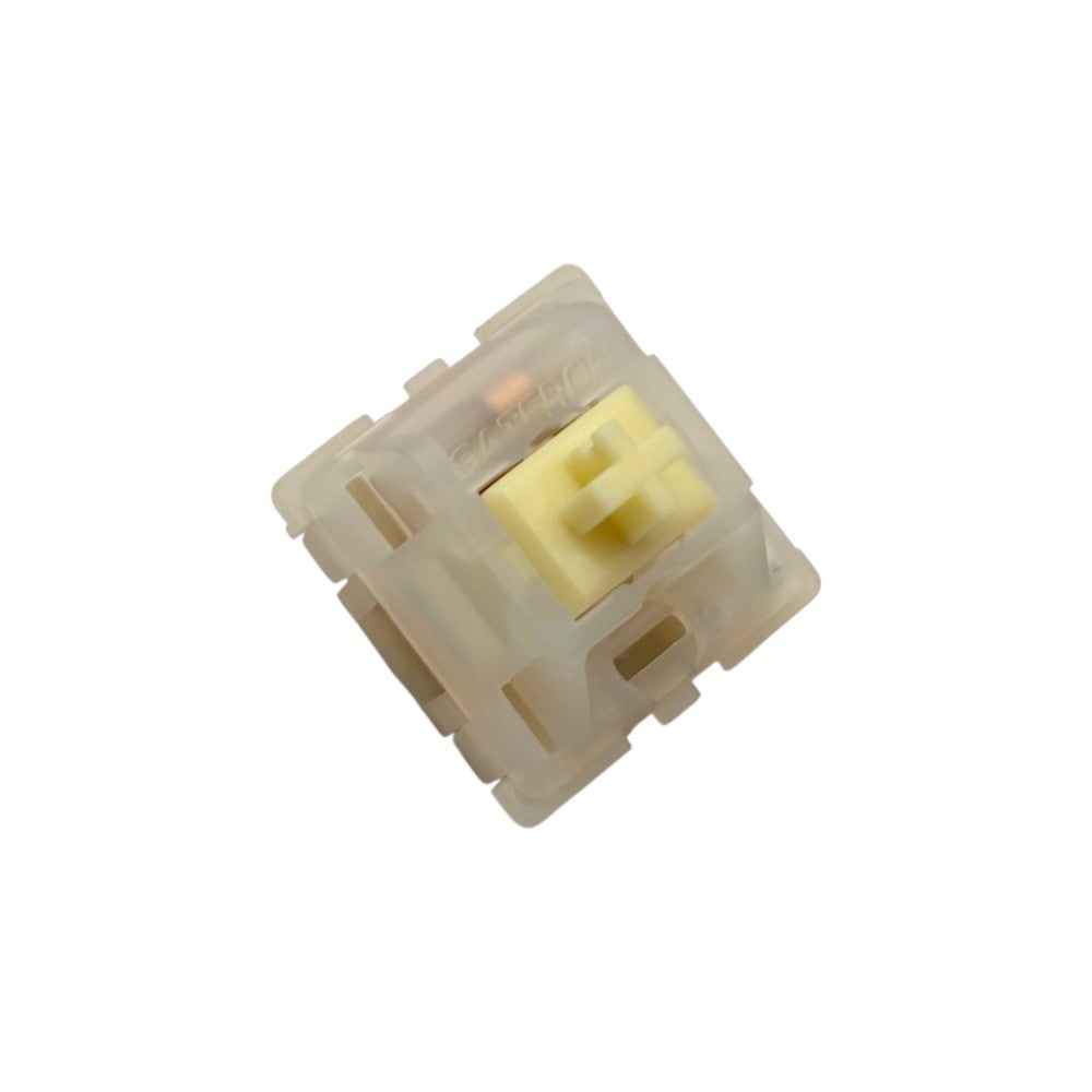 Angled front view of Gateron Milky Yellow Pro mechanical switch displaying molded Gateron logo and LED slot.