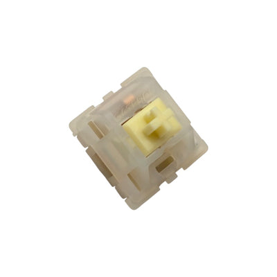 Angled front view of Gateron Milky Yellow Pro mechanical switch displaying molded Gateron logo and LED slot.