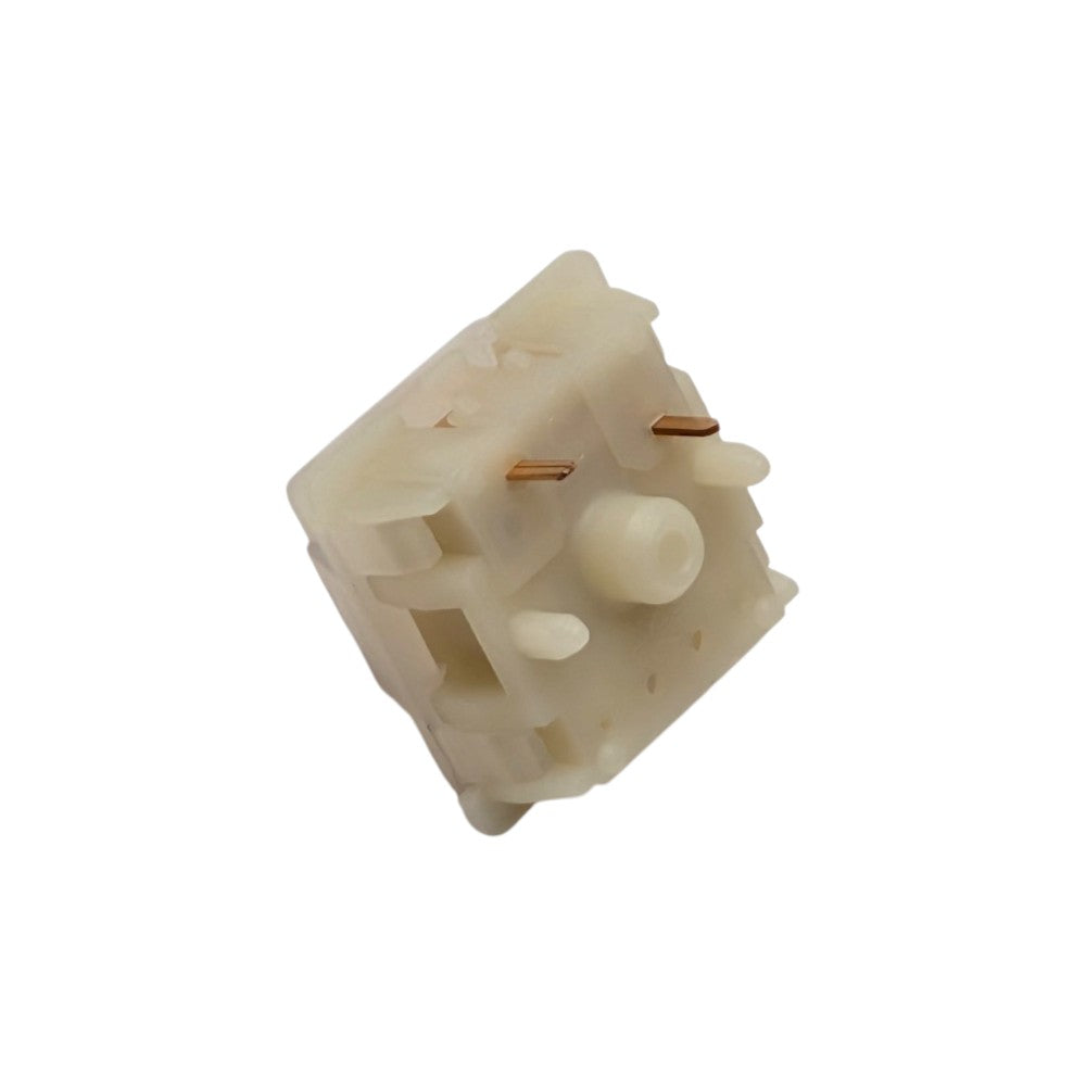 Bottom angled perspective shot of Gateron Milky Yellow Pro switch showing PCB mounting legs and stem pole orifice.