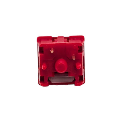 Directly overhead view of the red 5-pin PCB mount bottom housing and copper contacts on the HMX x JKDK Blossom switch.