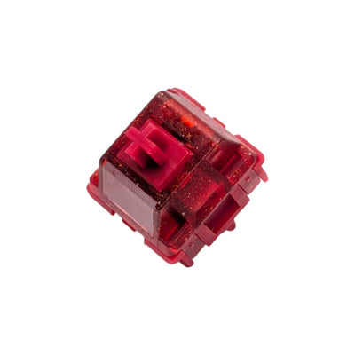 Angled front perspective of the HMX x JKDK Blossom mechanical switch highlighting the frosted LED diffuser lens and JKDK logo