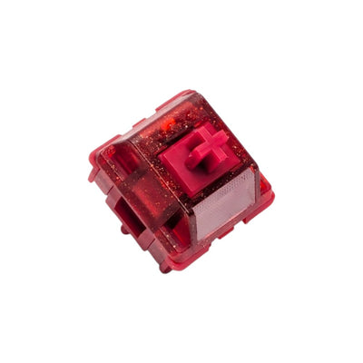 Side angle view of the red glitter PA12 top housing and latch clips on the HMX x JKDK Blossom switch.