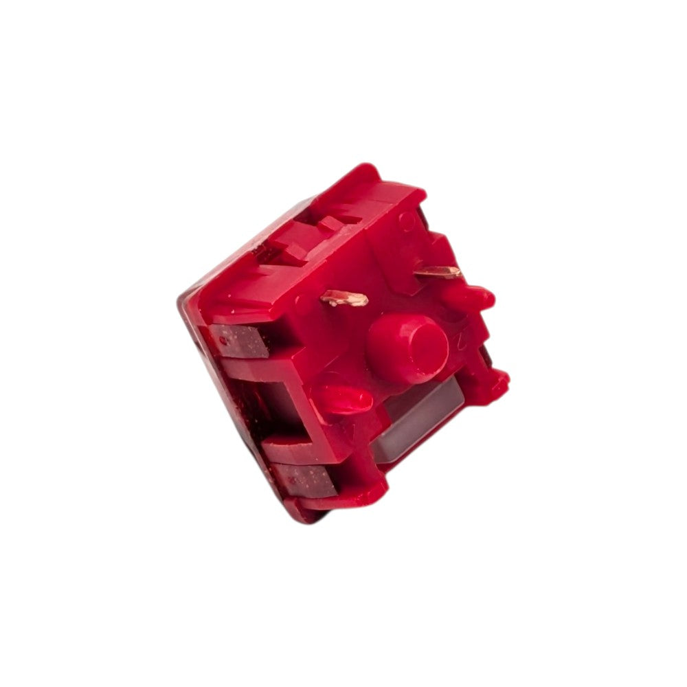 Bottom angled perspective shot of the HMX x JKDK Blossom linear switch displaying 5-pin legs and stem pole orifice.