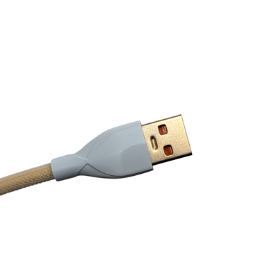 Detailed shot of the Ivory Cream coiled cable USB-A connection and premium metal housing, perfect for clean desk setup cable management.