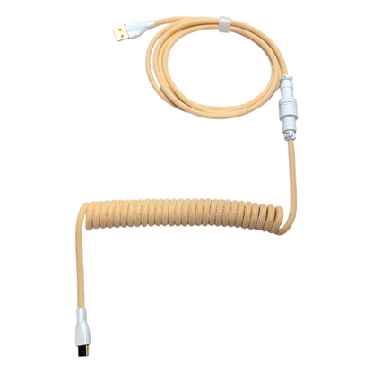 Ivory Cream custom coiled keyboard cable with a tight 6-inch coil and white USB-C connector for mechanical keyboards.