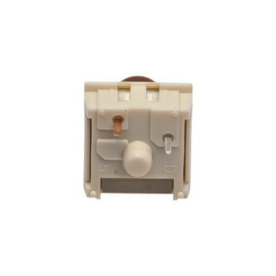 Directly overhead view of the 5-pin cream bottom housing and metal contact pins on Kailh Box Cream Pro switch.