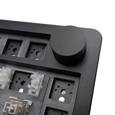 Macro detail of black aluminum rotary encoder knob on top right corner of Leobog Hi8 SE kit.