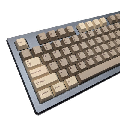 Close-up detail view of tan and cream alpha keys on Thock King Lumberjack Chop Thock PBT set.
