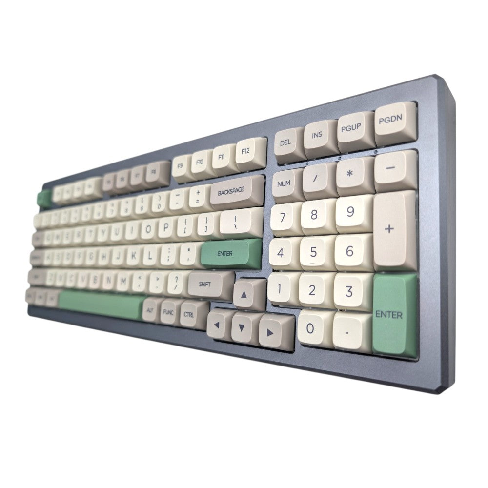 A retro-style mechanical keyboard with a dark gray chassis and cream-colored keys, accented with sage green keys on the Enter, Backspace, Shift, and Alt modifiers.