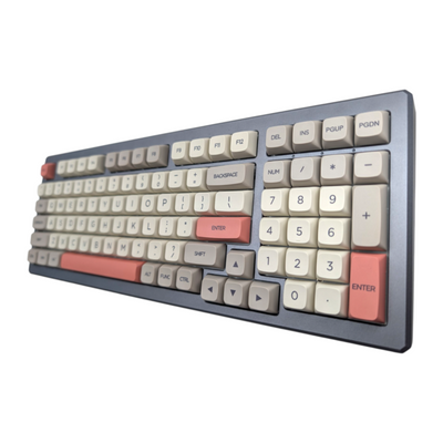 Angled side view of Retro 9009 PBT XDA keycaps showcasing salmon pink enter key and spacebar by Thock King.