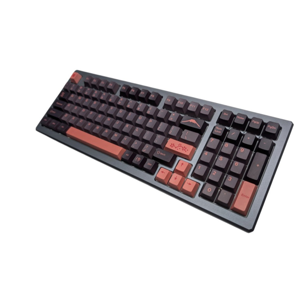 Wide angle shot of Yoru Sakura PBT keycaps mounted on custom mechanical keyboard with salmon spacebar.