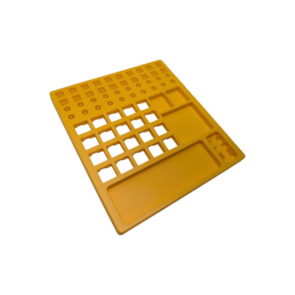 Yellow plastic switch lube station for mechanical keyboards showing 20 switch slots, 30 stem holders, spring posts, and built-in switch openers.